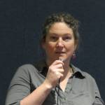Megan McPhee, associate professor of fisheries for University of Alaska Fairbanks, speaks during a Fireside Lecture Friday evening at Mendenhall Glacier Visitor Center, March 8, 2019. (Ben Hohenstatt | Juneau Empire)