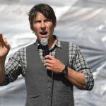 Zach Brown speaks during a Stand Strong for Climate rally in front of the Alaska State Capitol on Tuesday, Sept. 10, 2019. The rally included a march to Centennial Hall where the annual meeting of the International Forum of Sovereign Wealth Funds is taking place. The rally was organized by 350 Juneau, a local chapter of an international climate advocacy movement, 350.org. (Michael Penn | Juneau Empire)