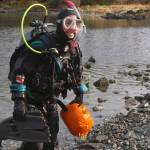 Annie Raymond returns to dry land with her jack-o-lantern titled Starry Starry Dive at the sixth annual Spooktacular Dive and Underwater Pumpkin Carving event Saturday, Oct. 26, 2019. (Ben Hohenstatt | Juneau Empire)