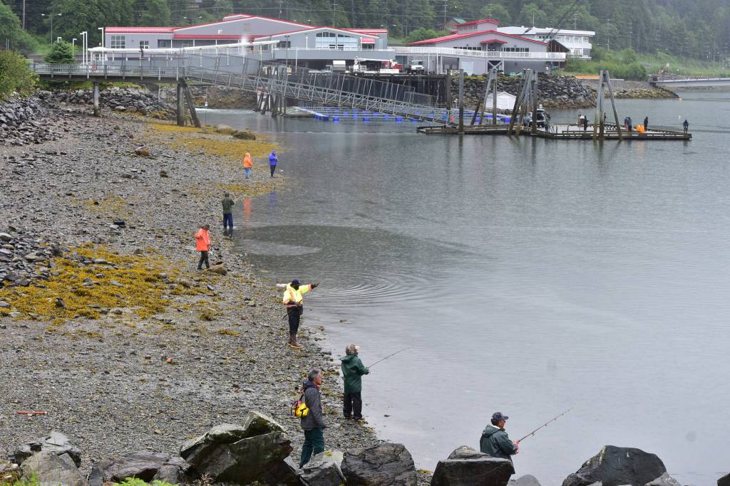Peter Segall | Juneau Empire                                 Fishermen along Channel Drive in Juneau on Friday, June 26, 2020. The Douglas Island Pink and Chum hatchery, seen in the distance, has reported much smaller returns of chum salmon this year. Hatchery officials are concerned about getting enough fish to maintain their broodstock.