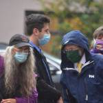 Sen. Jesse Kiehl, right, and Rep. Sara Hannan, back right, both Juneau Democrats, stepped out of their offices at the Captiol to join environmental protestors for a demonstration on the buildings steps. (Peter Segall / Juneau Empire)