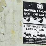 A banner protesting resource extraction in the Arctic was hung from a building in downtown Juneau on Wednesday, Oct. 21, 2020. On social media, activists posted photos of the banner in cities around the state and nation, and even as far away as London. (Peter Segall / Juneau Empire)