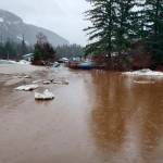 This photo shows damage from heavy rains and a mudslide 600 feet wide in Haines, Alaska, on Wednesday, Dec. 2, 2020. Authorities say six people are unaccounted for, and four homes were destroyed in the slide, with the search resuming Thursday morning for survivors. (Matt Boron / Alaska Department of Transportation and Public Facilities)