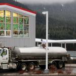 A truck stops outside Douglas Island Pink and Chum to pump in water on Thursday following damage to a pipeline caused by a landslide on Dec. 3, 2020. (Ben Hohenstatt / Juneau Empire)