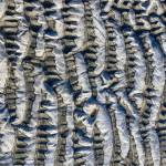 This photo shows frozen ripples in the sand at Eagle Beach in January 2021. (Courtesy Photo / Arthur Dee)
