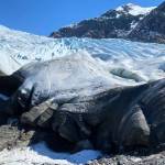 The edge of the Mendenhall Glacier, as seen on April 21, is black from scouring the side of the ridge as it moves down the valley. Courtesy Photo / Denise Carroll)
