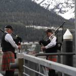 Members of the City of Juneau Pipe Band play their bagpipes during the 31st annual Blessing of the Fleet and Reading of Names at the Alaska Commercial Fishermens Memorial in Juneau on May 1, 2021. (Michael S. Lockett / Juneau Empire)