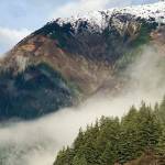 A low cloud nestles between snow-capped Mt. Juneau and Mt. Roberts on Oct. 26, 2021. (Courtesy Photo / Denise Carroll)