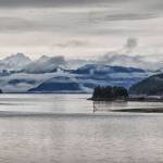 This photo shows the view down Gastineau Channel from the Douglas Bridge with clouds hanging over Williams, Butler and Irving peaks at Taku Inlet. (Courtesy Photo / Kenneth Gill, gillfoto)