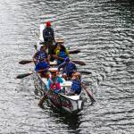 Members of One People Canoe Society paddle through Juneau harbor during the 12th Annual Maritime Festival on May 7, 2022. (Michael S. Lockett / Juneau Empire)
