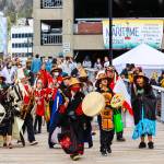 Members of the Yées Ḵu.oo multicultural dance group advance up the pier during the 12th Annual Maritime Festival on May 7, 2022. (Michael S. Lockett / Juneau Empire)