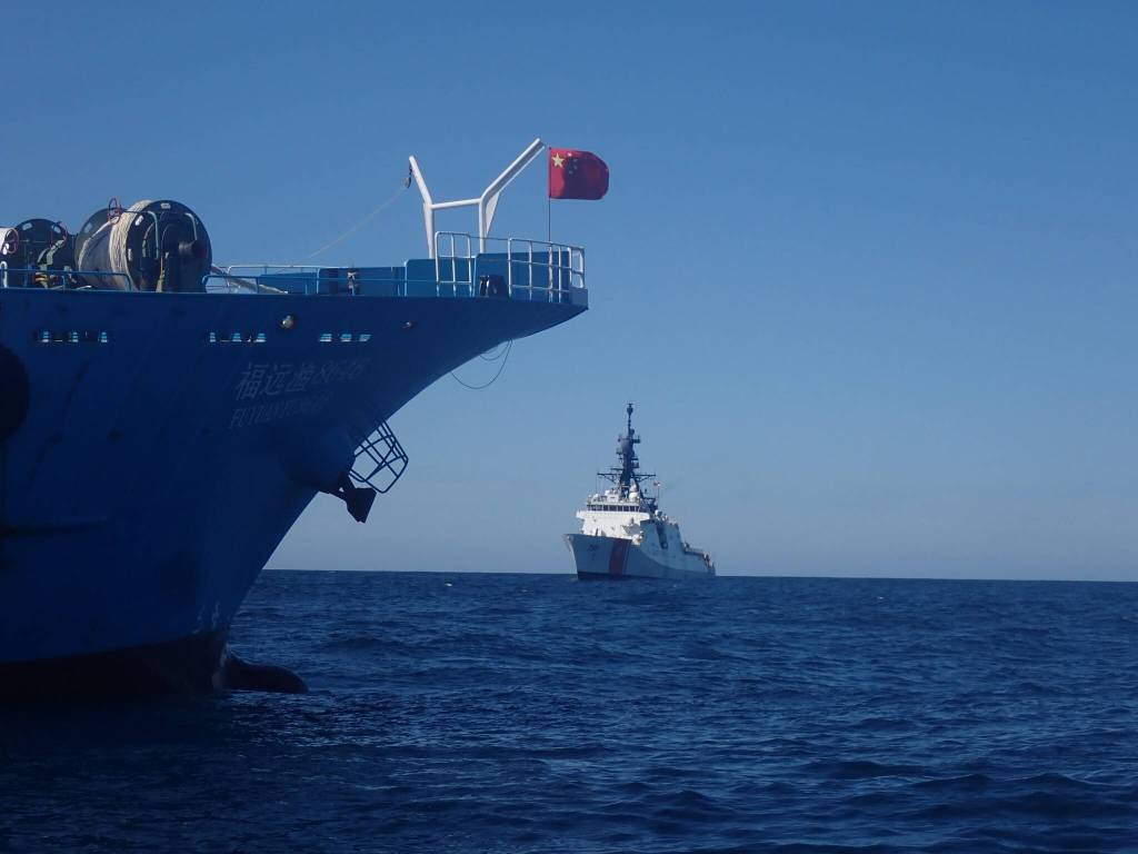Crews aboard U.S. Coast Guard Cutter Bertholf prepare to board a fishing vessel in the North Pacific on Sep. 21, 2021. The Bertholf crew was patrolling in support of Operation North Pacific Guard, the Coast Guards component of a multilateral fisheries law enforcement operation designed to detect and deter illegal, unreported and unregulated fishing activity. (Courtesy photo / U.S. Coast Guard)