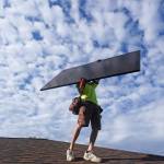 A workman from Power Shift Solar installs a solar panel Thursday, Aug. 11, 2022, in Salt Lake City. Congress is poised to pass a transformative climate change bill on Friday, Aug. 12. The crux of the long-delayed bill is to use incentives to accelerate the expansion of clean energy such as wind and solar power, speeding the transition away from the oil, coal and gas that largely cause climate change. (AP Photo / Rick Bowmer)