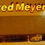 Ravens roost for the night on the letters of a grocery store in Fairbanks. (Courtesy Photo / Douglas Yates)