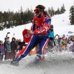 A snowboarder glides over the skim pond at Eaglecrest Ski Area as they partake in the return of the Slush Cup Saturday afternoon. (Clarise Larson / Juneau Empire)