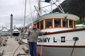 Longtime Juneau resident Joe Emerson, co-owner of the F/V Tommy L II berthed in Aurora Harbor, smiles for a photo next to his boat in late May. Emerson is one of the hundreds of trollers in Southeast Alaska that will be directly impacted by a federal court order that may force the closure of the regions king salmon troll fishery set to begin July 1. (Clarise Larson / Juneau Empire)