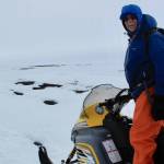 Craig George leads Ned Rozell on a snowmachine trail north of Utqiagvik in May 2010. (Photo by Ned Rozell)