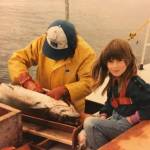 A young Tele Aadsen with her father Ken Aadsen on the familys 40-foot trimaran hand troller in 1985. Aadsen, a commercial fisher and author of What Water Holds, will be visiting Hearthside Books downtown at 6 p.m. on Sunday, Sept. 17. (Photo courtesy Val Aadsen)