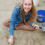 UAF Ph.D. student Audrey Rowe trowels loess soil at an archeological site in the uplands of Interior Alaska. (Photo by Mat Wooller)