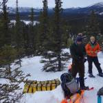 From left, Cole Richards, Lynn Kaluzienski and Carl Tape prepare to stick seismometers in frozen ground during a February 2019 mission to deploy instruments along the Denali seismic fault. The instruments helped scientists recently find the presence of a body of molten rock seven miles deep. (Photo by Ned Rozell)