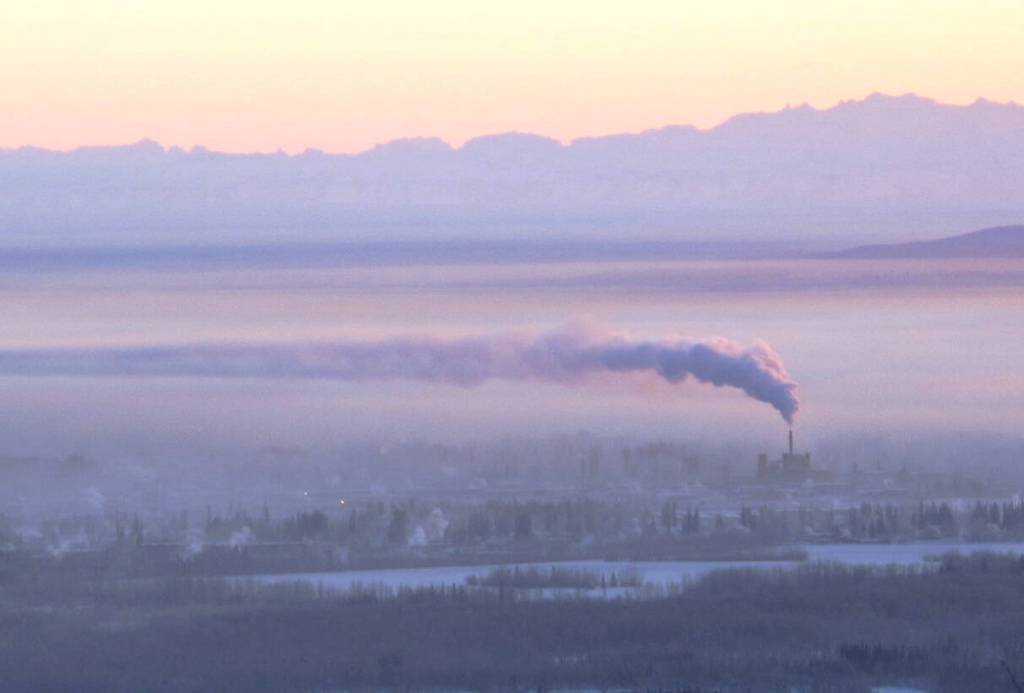 Downtown Fairbanks is blanketed in ice fog beneath the exhaust of a coal-fired power plant in January 2012. (Photo by Ned Rozell)