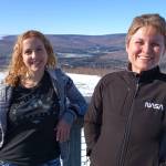 Astrophysicists Lindsay Glesener, left, and Sabrina Savage enjoy the sunshine on an observation deck at the Neil Davis Science Center on a hilltop at Poker Flat Research Range north of Fairbanks. Their pair of rockets launched from Poker Flat on April 17, 2014. (Photo by Ned Rozell)