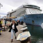 Jasmine Chavez, a crew member aboard the Quantum of the Seas cruise ship, waves to her family during a cell phone conversation after disembarking from the ship at Marine Park on Friday. (Mark Sabbatini / Juneau Empire)