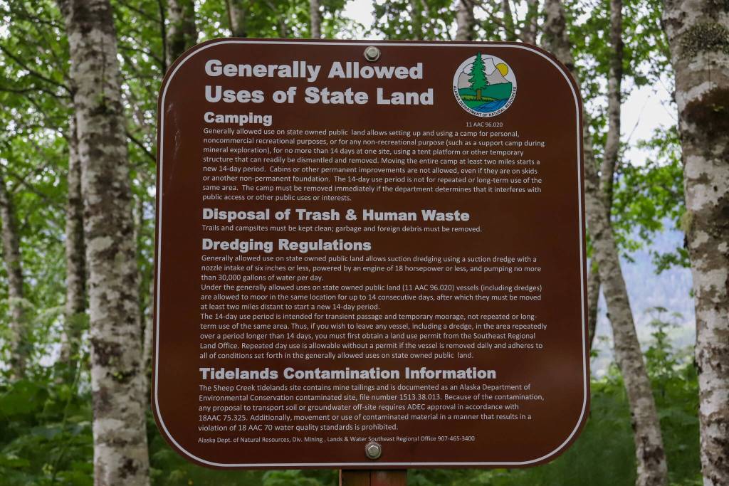 A generally allowed uses of state land sign is posted near the Sheep Creek delta. (Jasz Garrett / Juneau Empire)