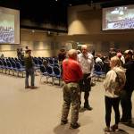Residents talk to city leaders and other officials about the response to this years record flooding from Suicide Basin during a Juneau Assembly meeting Monday night at Centennial Hall. (Mark Sabbatini / Juneau Empire)
