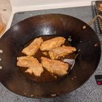 Frying Szechwan-style fish. (Photo by Patty Schied)