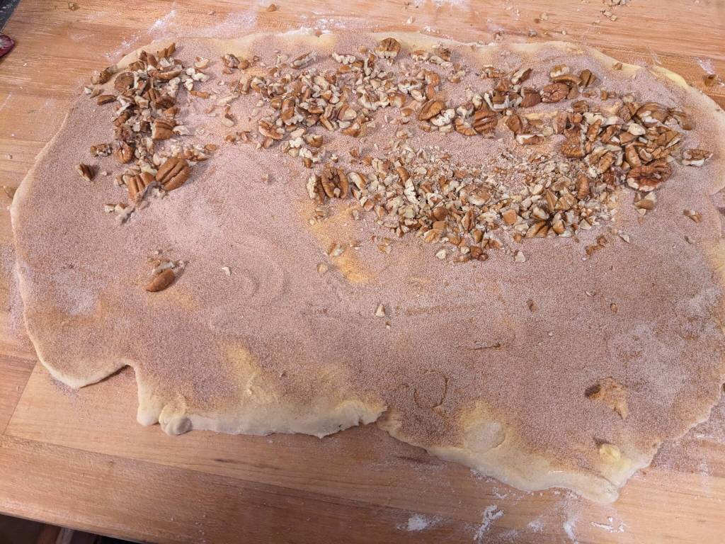 Layering filling for cinnamon rolls. (Photo by Patty Schied)