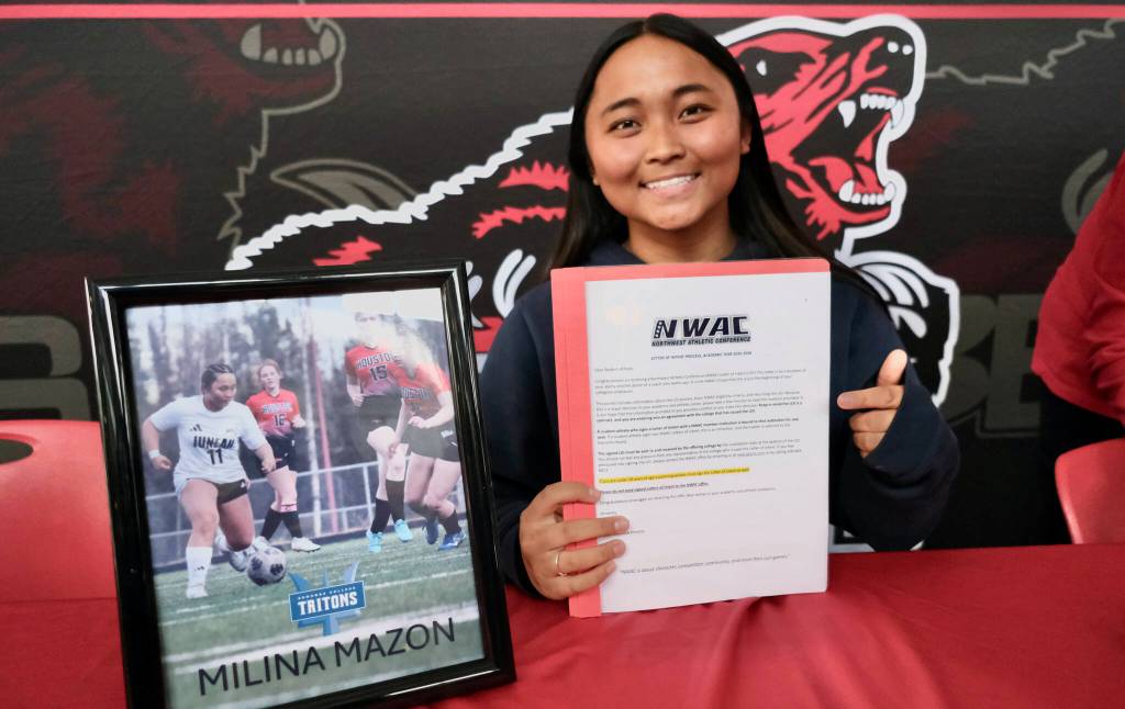 Juneau-Douglas High School: Yadaa.at Kalé senior Milina Mazon shows her Northwest Athletic Conference Letter of Intent on Monday in the JDHS commons to attend Edmonds College in Lynnwood, Washington, and play soccer for the Tritons. (Klas Stolpe / Juneau Empire)