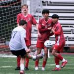 Juneau-Douglas High School: Yadaa.at Kalé senior Owen Rumsey, junior Kevin Flores-Lopez (6) and sophomore Sam Mazon defend a free kick by Soldotna junior Lane Hillyer (17) during the Crimson Bears 3-0 win over the Stars on Thursday at Adair Kennedy Memorial Park. (Klas Stolpe / Juneau Empire)
