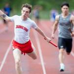 Juneau-Douglas High School: Yadaa.at Kalés Carter Harralston crosses the finish line of the boys 4x100 meter relay during the Ketchikan Invitational at Esther Shea Field on Saturday. The relay team, comprised of Orion Paden, Finley Hightower, Johnathyn Kestel and Carter Harralston, won the event with a time of 44.81. (Christopher Mullen/ Ketchikan Daily News)