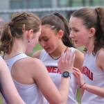 Juneau-Douglas High School: Yadaa.at Kalé junior distance runners Della Mearig and Lua Mangaccat and freshman Sunna Schane congratulate each other during an event at the Capital City Classic this year. The Region V Track & Field championships are Friday and Saturday at Thunder Mountain Middle School. (Klas Stolpe / Juneau Empire)