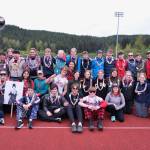 The Juneau-Douglas High School: Yadaa.at Kalé Track & Field team seniors and coaches pose Friday after day one of the Region V Championships at Thunder Mountain Middle School. (Klas Stolpe / Juneau Empire)