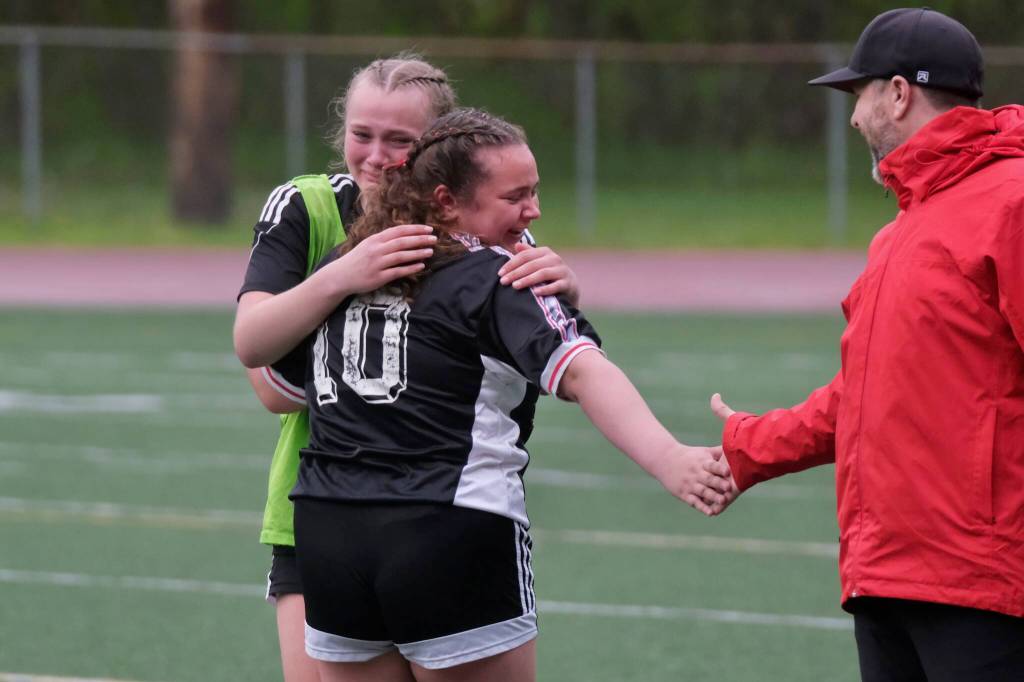 Juneau-Douglas High School: Yadaa.at Kalé senior Natalie Travis (10) subs out of her final home game during the Crimson Bears senior appreciation game Saturday at Adair-Kennedy Memorial Park. (Klas Stolpe / Juneau Empire)