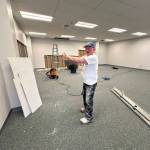 Kim Anderson, director of operations at the Mendenhall Mall, shows where the new space for Rainforest Play area will be in the mall on Friday, May 30, 2025. (Mark Sabbatini / Juneau Empire)