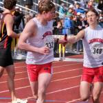 Juneau-Douglas High School: Yadaa.at Kalés Finn Lamb takes the baton from Ferguson Wheeler in the boys 4x800 relay during the 2025 ASAA/First Bank Alaska State Track & Field Championships on Saturday at Anchorages Dimond High School. (Klas Stolpe / Juneau Empire)