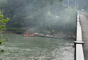 Smoke from an extinguished fire at a homeless camp is seen at the Brotherhood Bridge on Friday evening. (Mark Sabbatini / Juneau Empire)