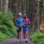 Snow Doubts Lauren Tanel and Dimond Dogs David Fure run the Auke Lake Trail in the first leg of the Seacoast Relay on Sunday, June 8, 2025. (Klas Stolpe / Juneau Empire)
