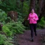 A racer on the Auke Lake Trail in the first leg of the Seacoast Relay on Sunday, June 8, 2025. (Klas Stolpe / Juneau Empire)