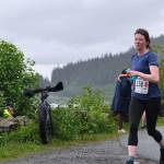 Olivia Glasscock of team Running For The Burritos approaches the finish line of the Seacoast Relay at the Eagle Beach State Park outer beach picnic shelter on Sunday, June 8, 2025. (Klas Stolpe / Juneau Empire)