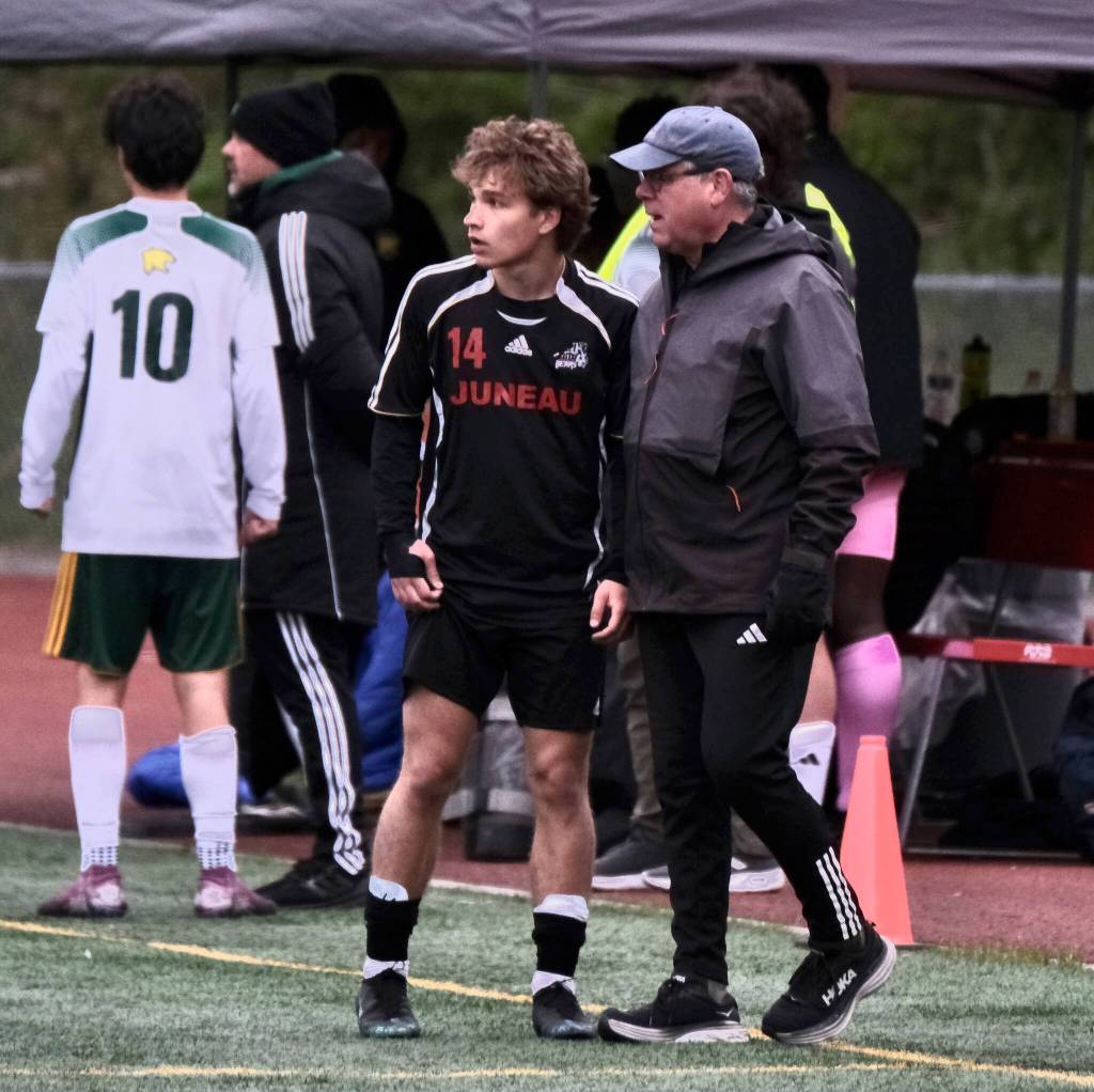 Kai Ciambor, a 2025 graduate of Juneau-Douglas High School: Yadaa.at Kalé, talks with Crimson Bears coach Gary Lehnhart during their game against Service in the ASAA Division I Soccer State Championships at Wasilla High School on May 29. Ciambor was selected the Gatorade Alaska Boys Soccer Player of the Year on Thursday. (Klas Stolpe / Juneau Empire)