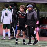 Kai Ciambor, a 2025 graduate of Juneau-Douglas High School: Yadaa.at Kalé, talks with Crimson Bears coach Gary Lehnhart during their game against Service in the ASAA Division I Soccer State Championships at Wasilla High School on May 29. Ciambor was selected the Gatorade Alaska Boys Soccer Player of the Year on Thursday. (Klas Stolpe / Juneau Empire)