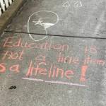 Chalk message written outside the governor's mansion reading, 'Education is not a line item its a lifeline!'. Written on Friday, June 13, 2025. (Natalie Buttner / Juneau Empire)