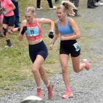 Nevadas Claire Nelson, 22, and Anchorages Taylor Deal, 31, approach the mountain during the womens race at the Mount Marathon Race on July 4, 2025, in Seward, Alaska. (Photo by Jeff Helminiak/Peninsula Clarion)
