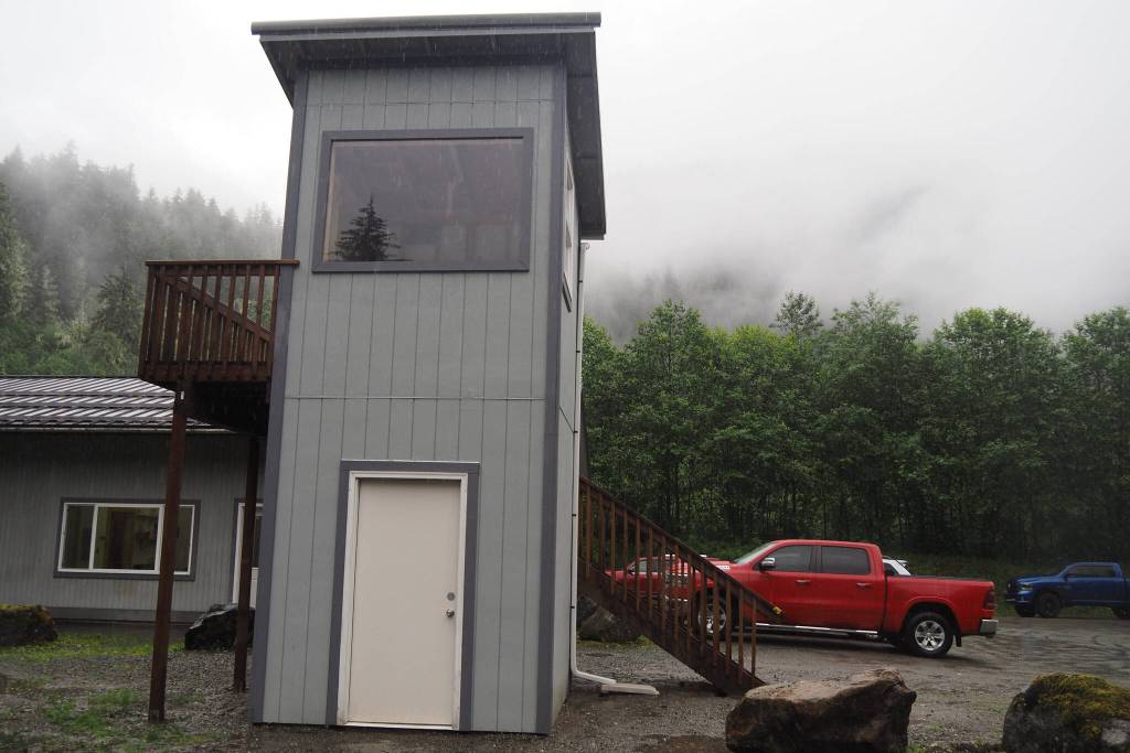 The control tower that Max Webster built standing in the summer rain on Tuesday, July 9, 2025. (Natalie Buttner / Juneau Empire)