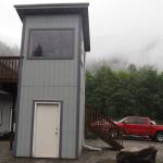 The control tower that Max Webster built standing in the summer rain on Tuesday, July 9, 2025. (Natalie Buttner / Juneau Empire)