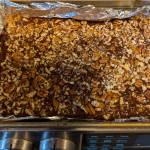 Toasted nuts top this shortbread cookie bar.
